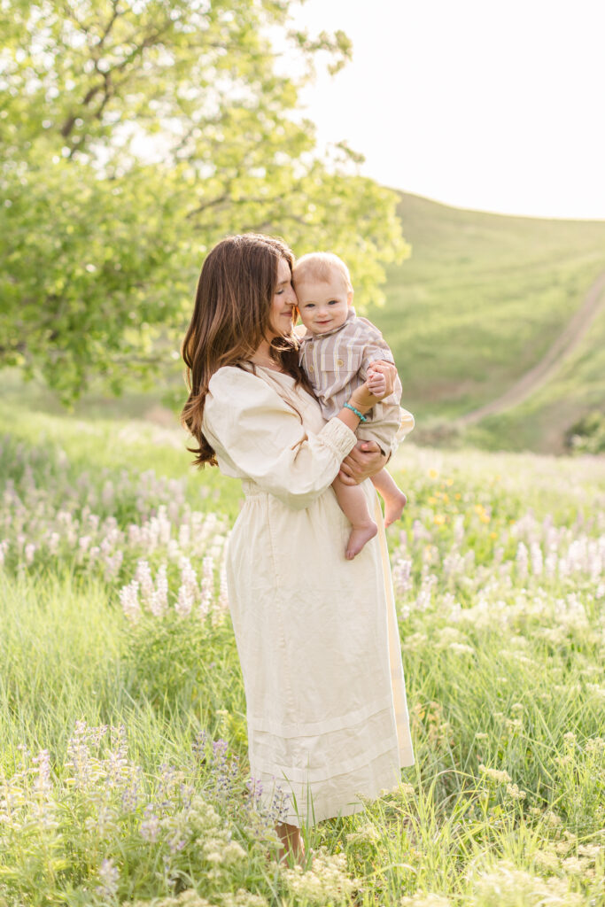 a mom holding her son during photoshoot in davis county