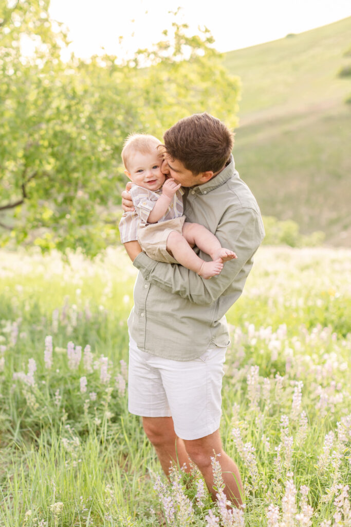 a dad holding his son during photoshoot in davis county